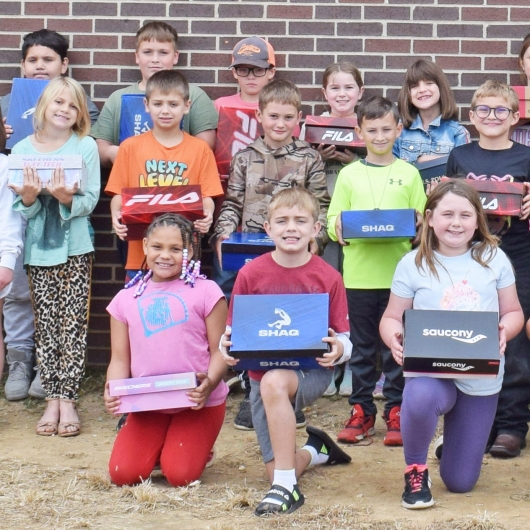Izard County Consolidated third graders with their new shoes