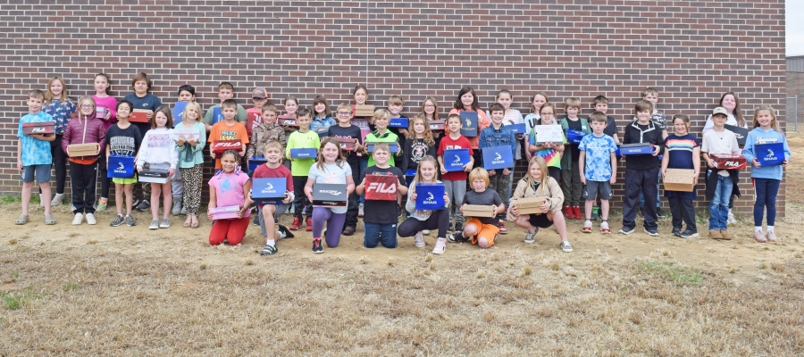 Izard County Consolidated third graders with their new shoes