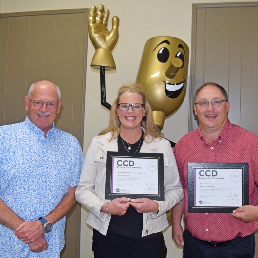 Loftis, Walling earn Credential Cooperative Director 